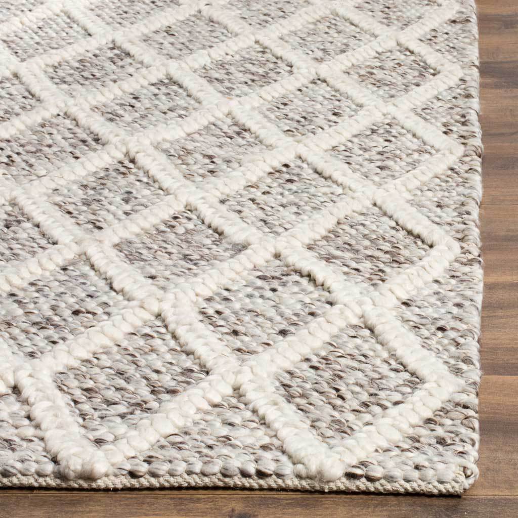 Ivory trellis lines rise above stone-toned woven loops, with a neatly finished edge.