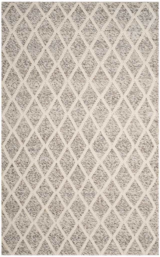 A richly textured stone ground and raised ivory diamond lattice give this handwoven area rug soft dimension.