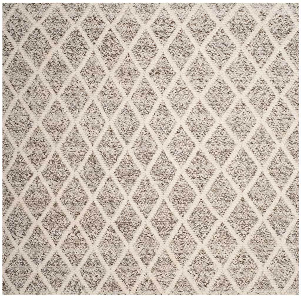 Intersecting ivory lines form an allover diamond pattern across this stone-toned square rug.