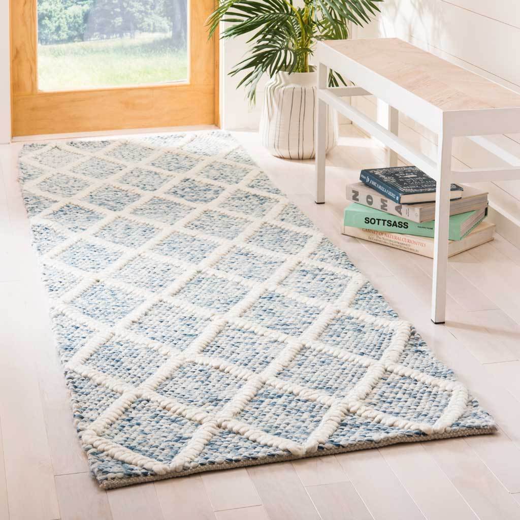A plush blue and ivory runner brings geometric style to a bright entryway