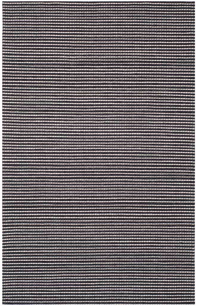 Narrow black stripes contrast with ivory loops for a bold, richly textured rug.