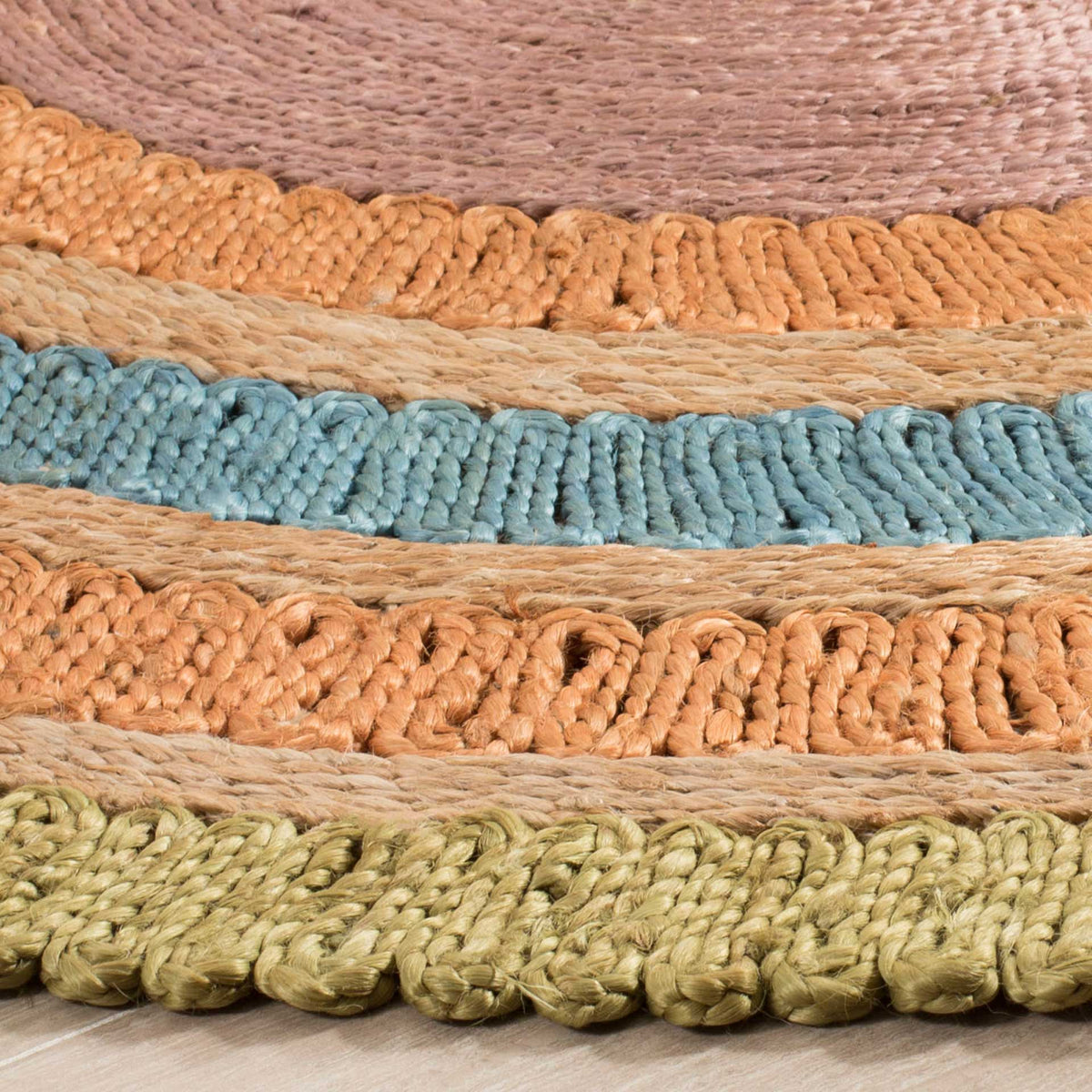 Chunky olive, teal, and terracotta loops contrast with tightly braided natural jute.