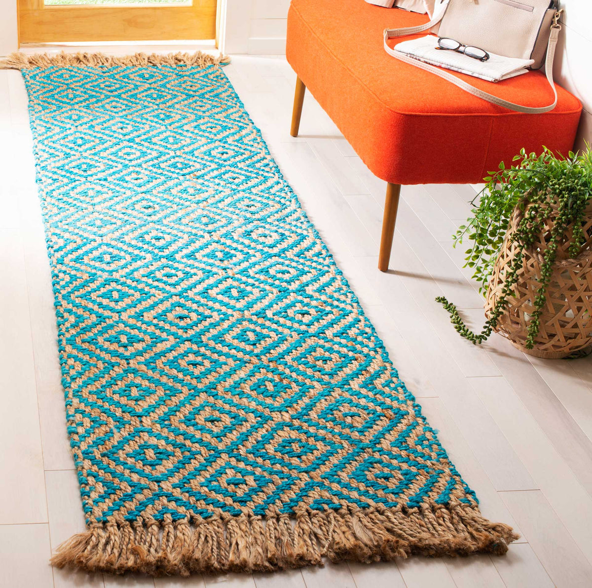 Bright turquoise diamonds and generous natural fringe bring lively color to an entryway.