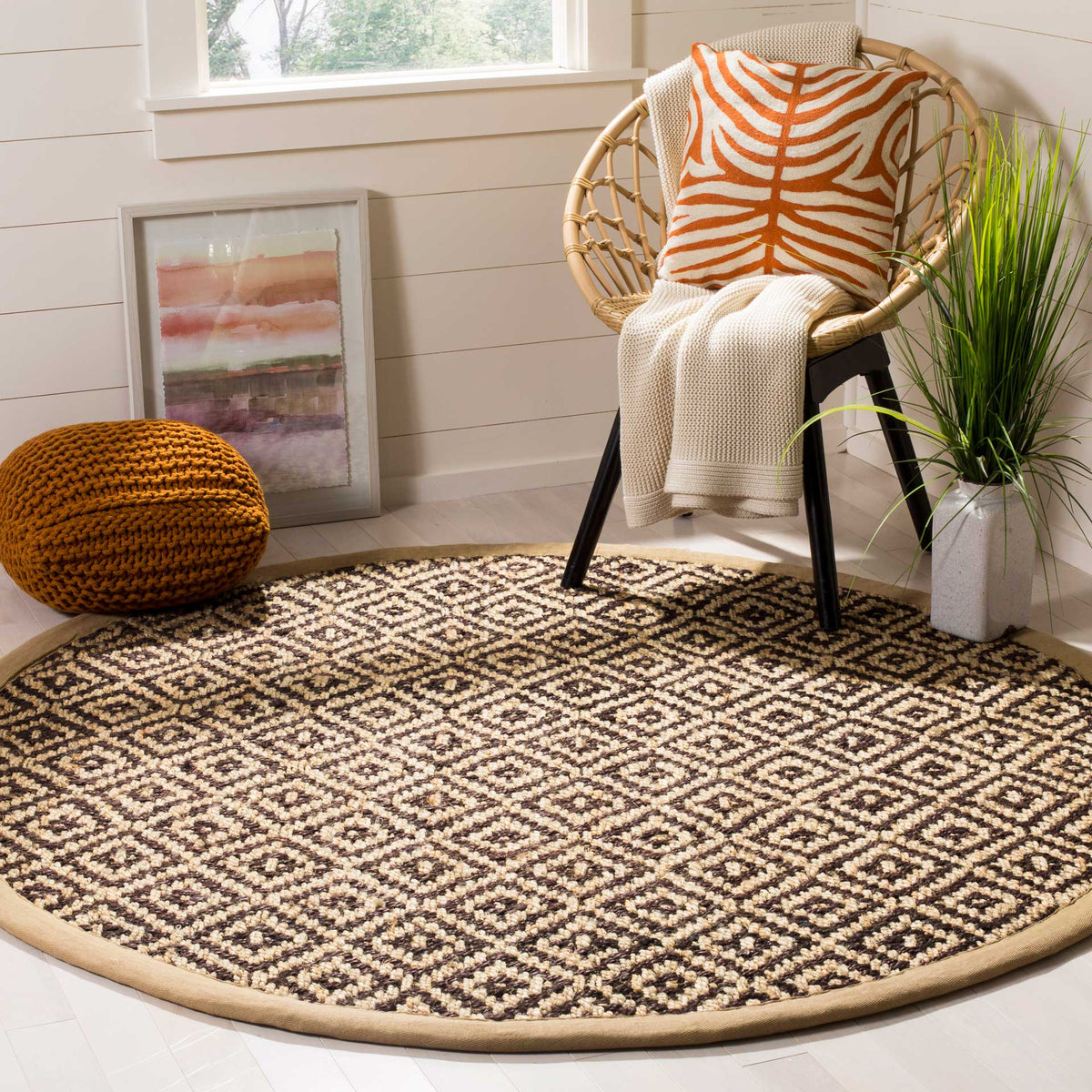 Graphic brown diamonds bring depth to a neutral jute rug with a clean tan border.