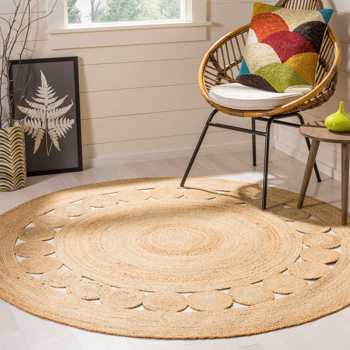 A honey-toned braided center and openwork circle border add handcrafted character to the floor.