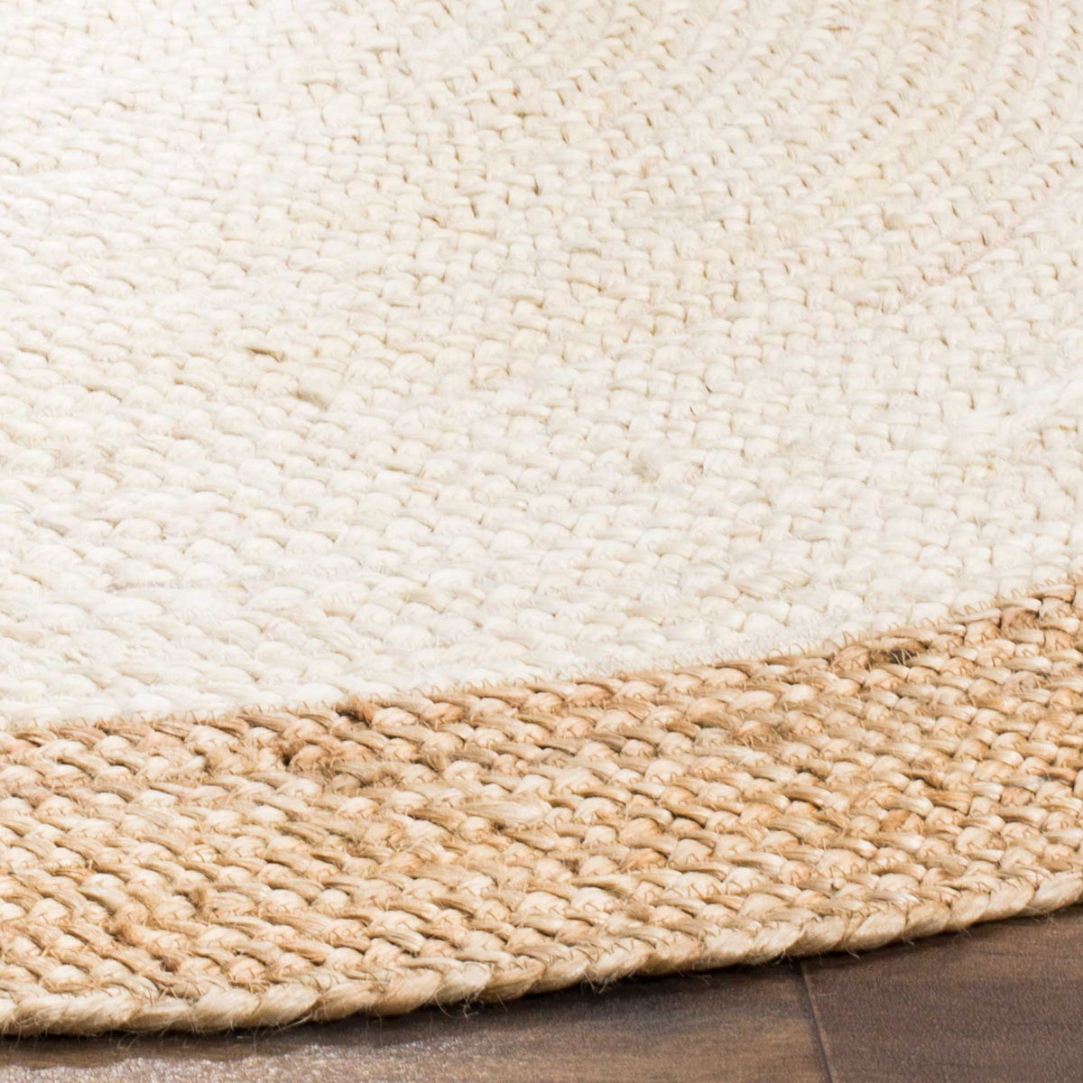 Thick ivory jute stitches meet a braided natural border for earthy contrast.