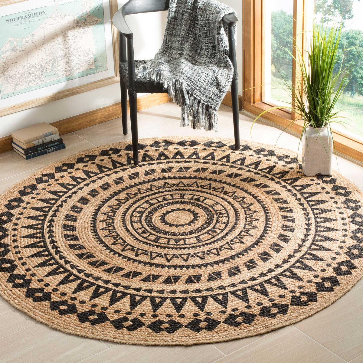 Concentric black motifs and an earthy jute weave bring graphic warmth to this round rug.
