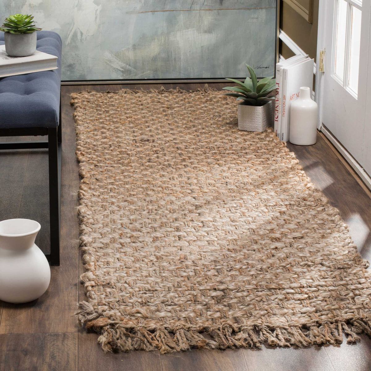 Chunky jute loops and rustic fringe give this natural runner a welcoming, tactile feel.