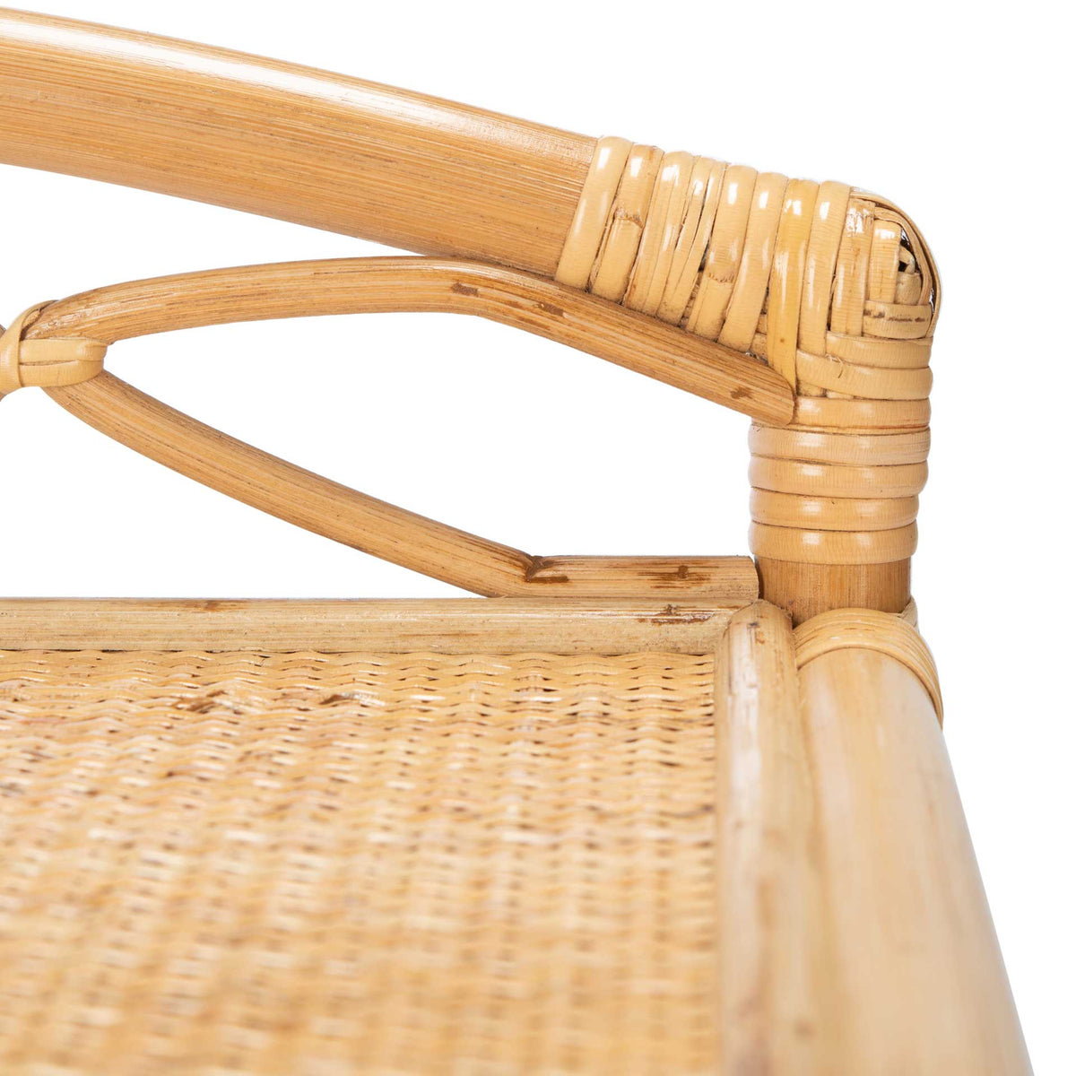Wrapped rattan joins a curved lattice rail above a tightly woven tabletop