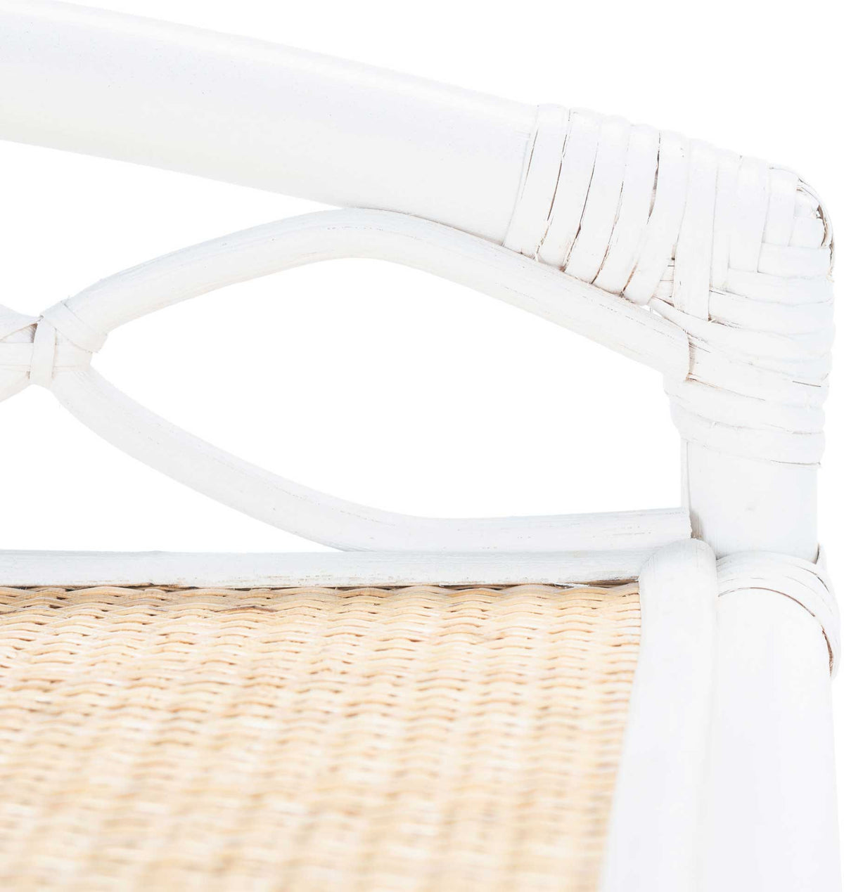 White wrapped rattan forms a curved lattice rail above the natural cane tabletop