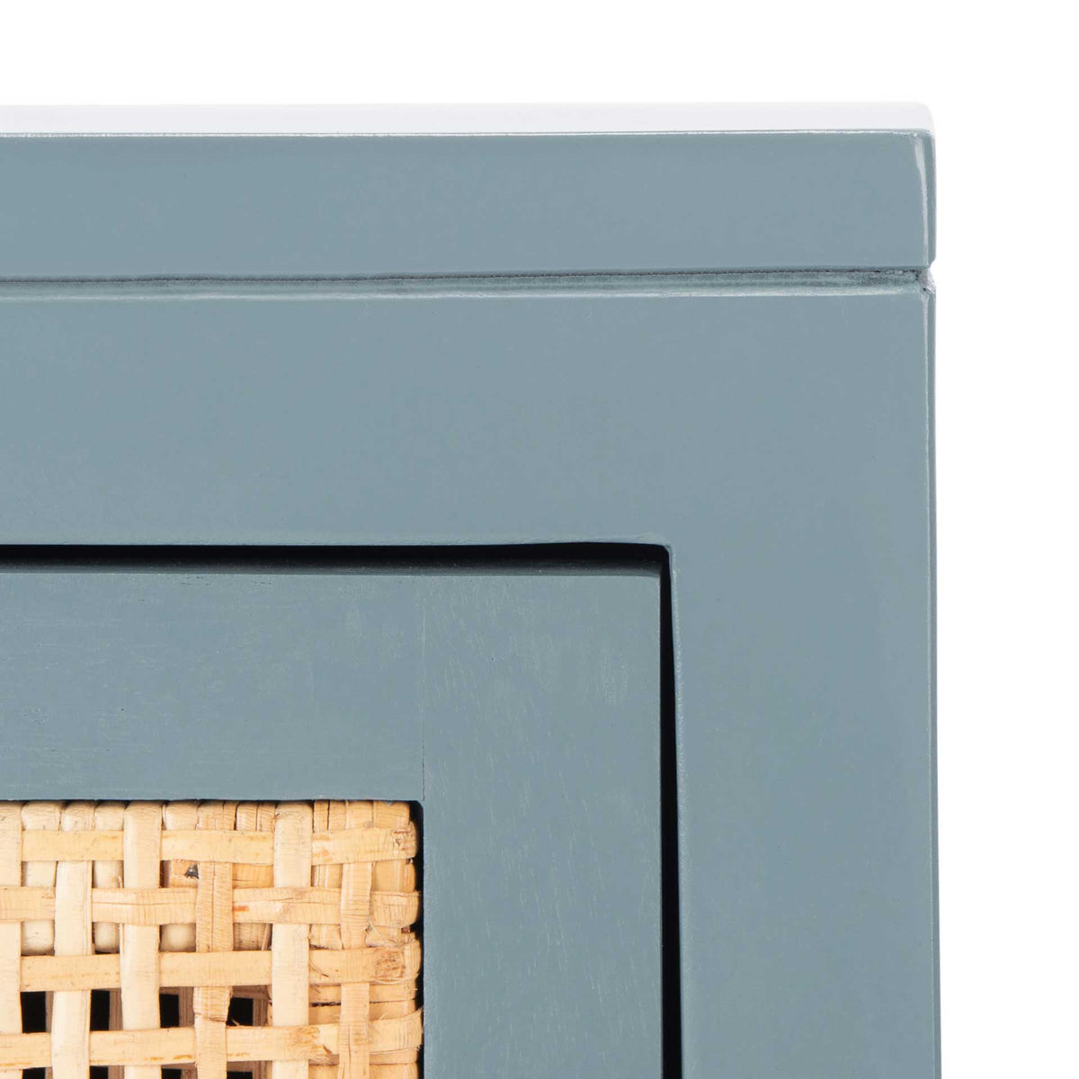 Pale natural cane weave brings warmth to the blue-gray frame and inset panel.