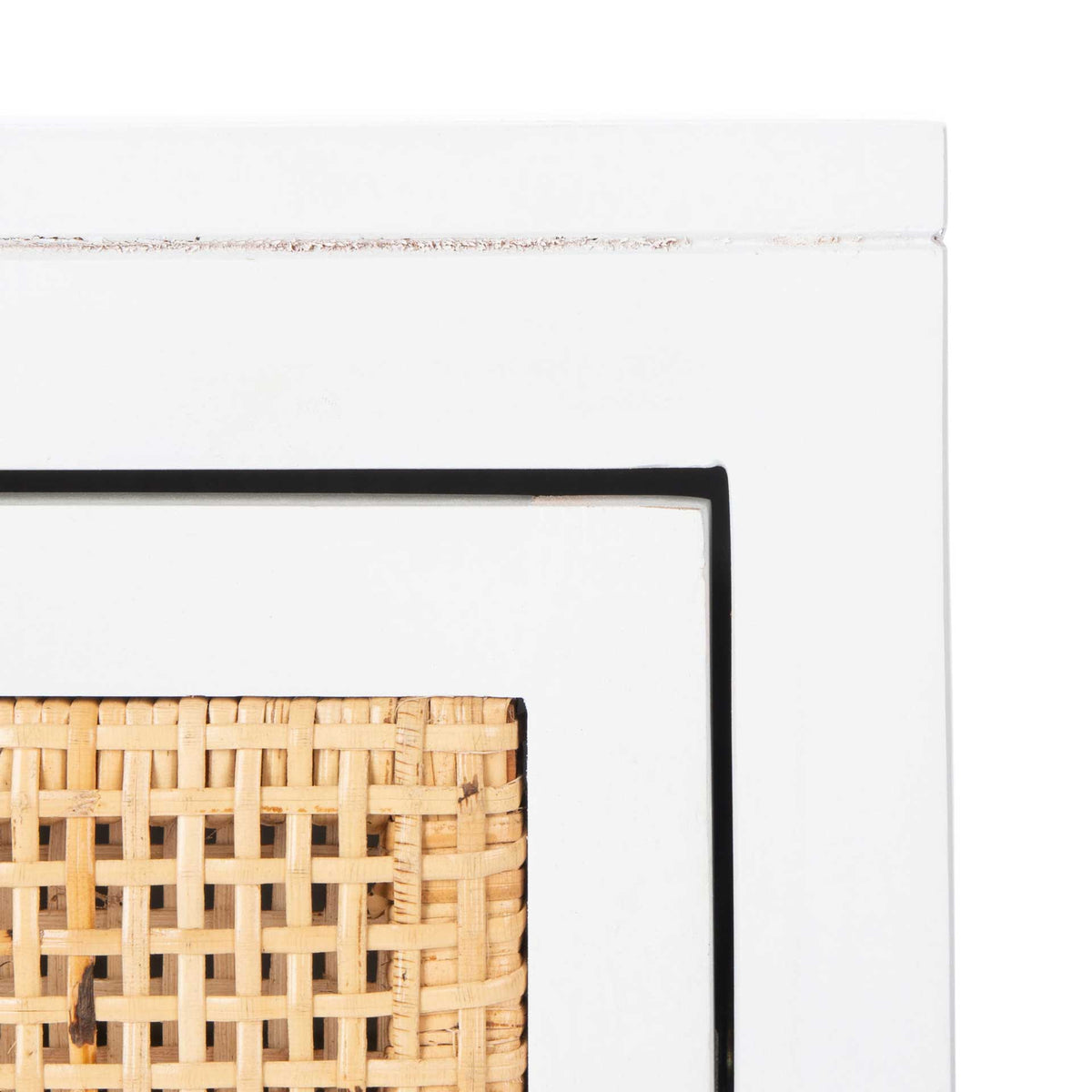 Natural cane weaving lends texture to the white wood frame and inset drawer panel.