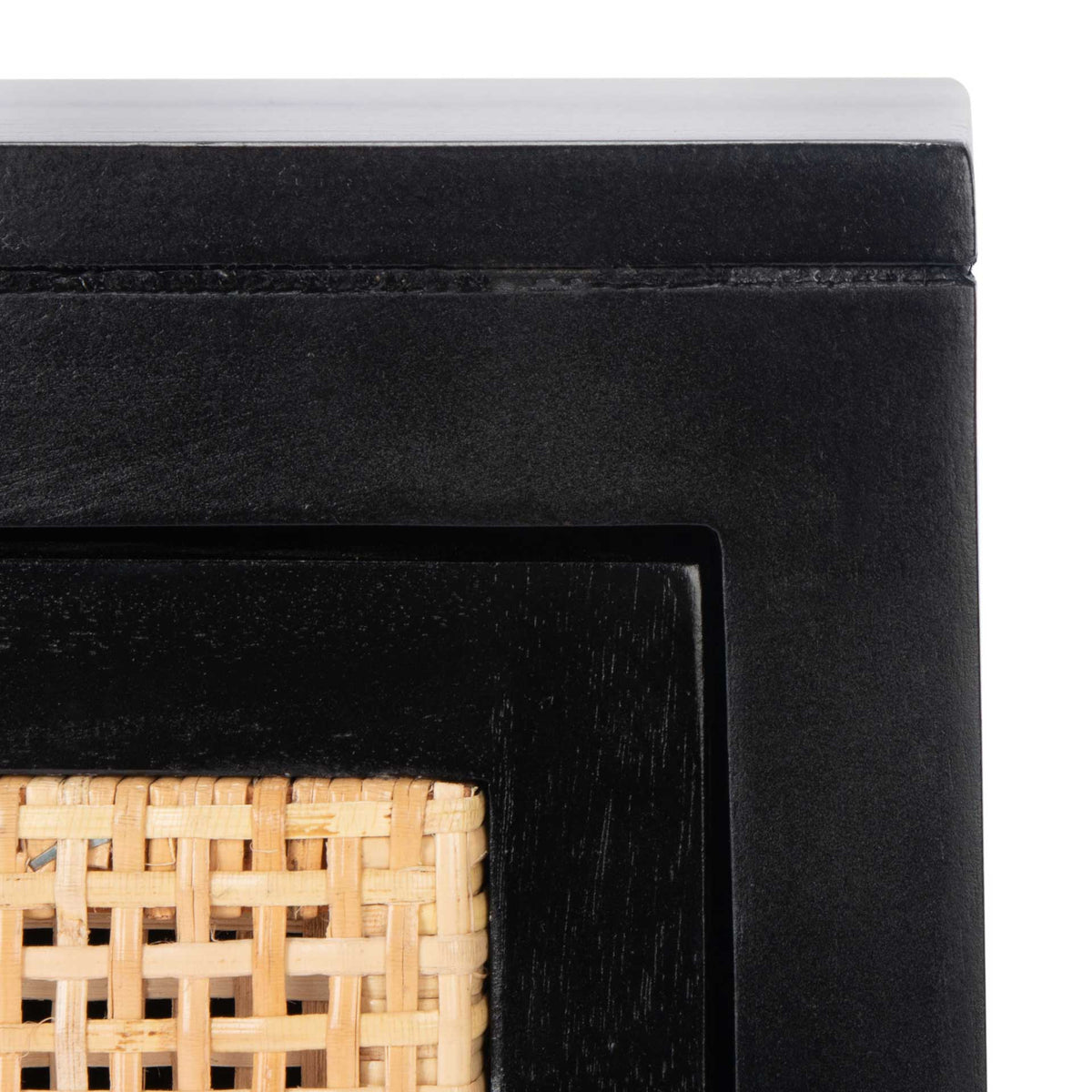 Black wood trim frames the natural cane weave beneath a smooth, flat top