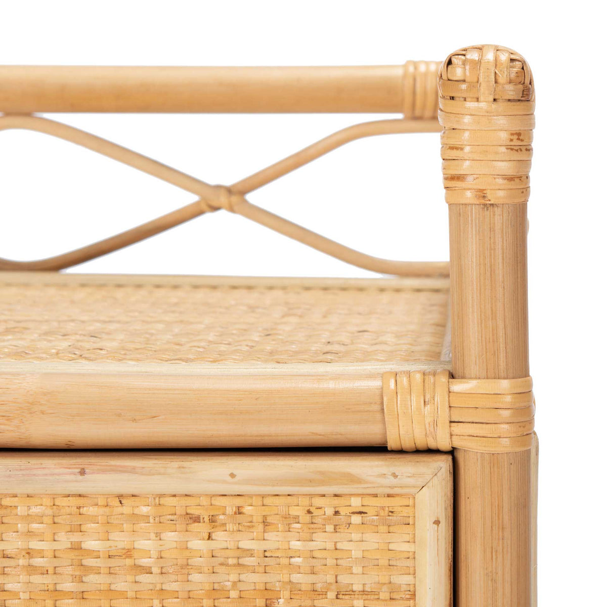 Wrapped rattan joints and crossed rails frame the natural woven top of this nightstand