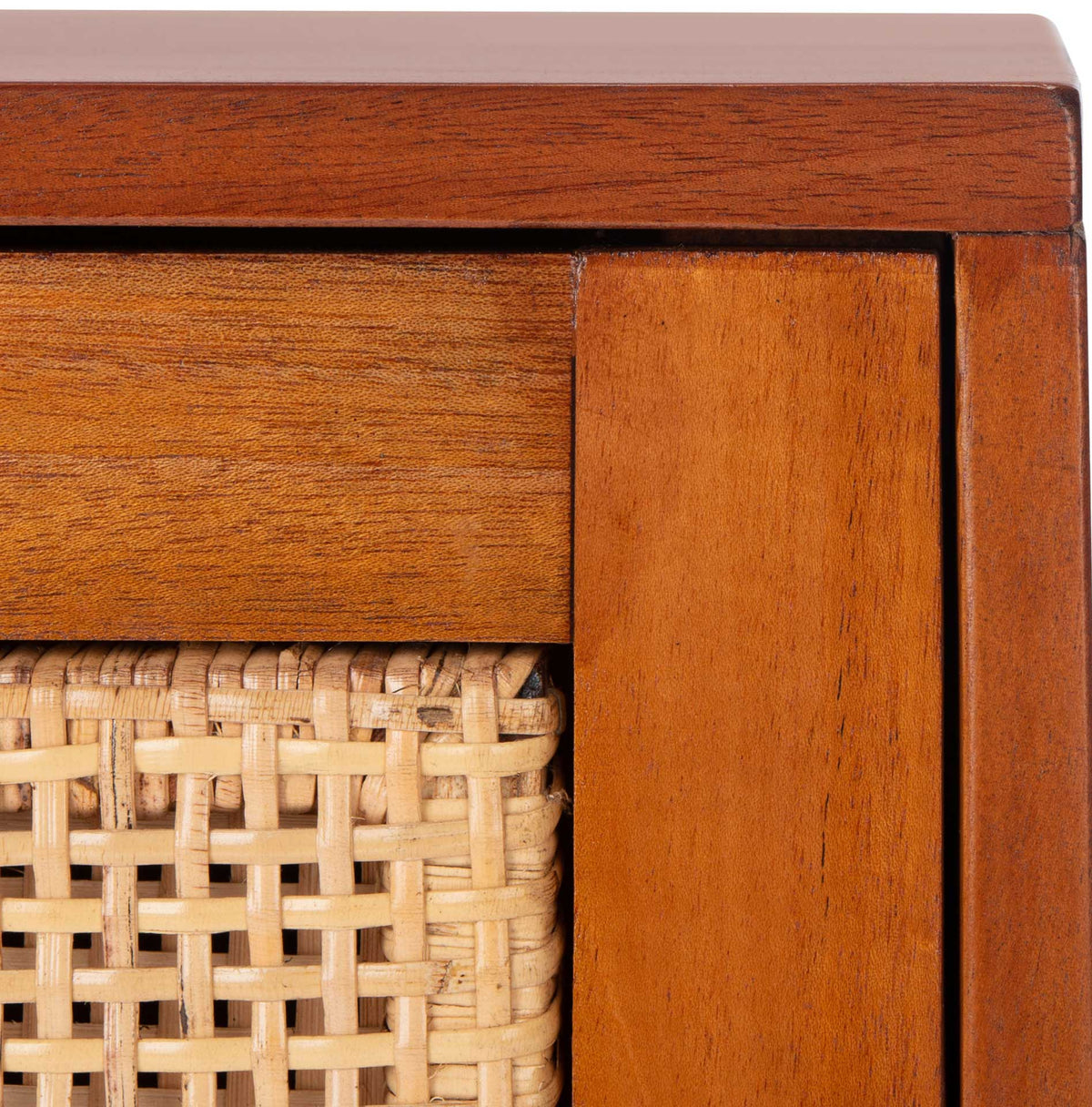 Natural woven cane sits within a warm wood drawer frame for inviting texture.