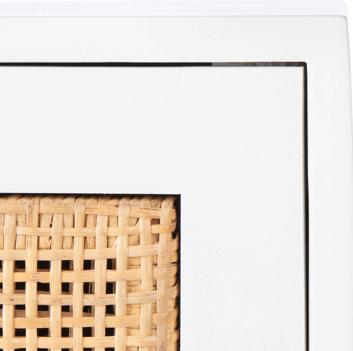 Natural cane weave adds warm texture within the smooth white wood drawer frame.