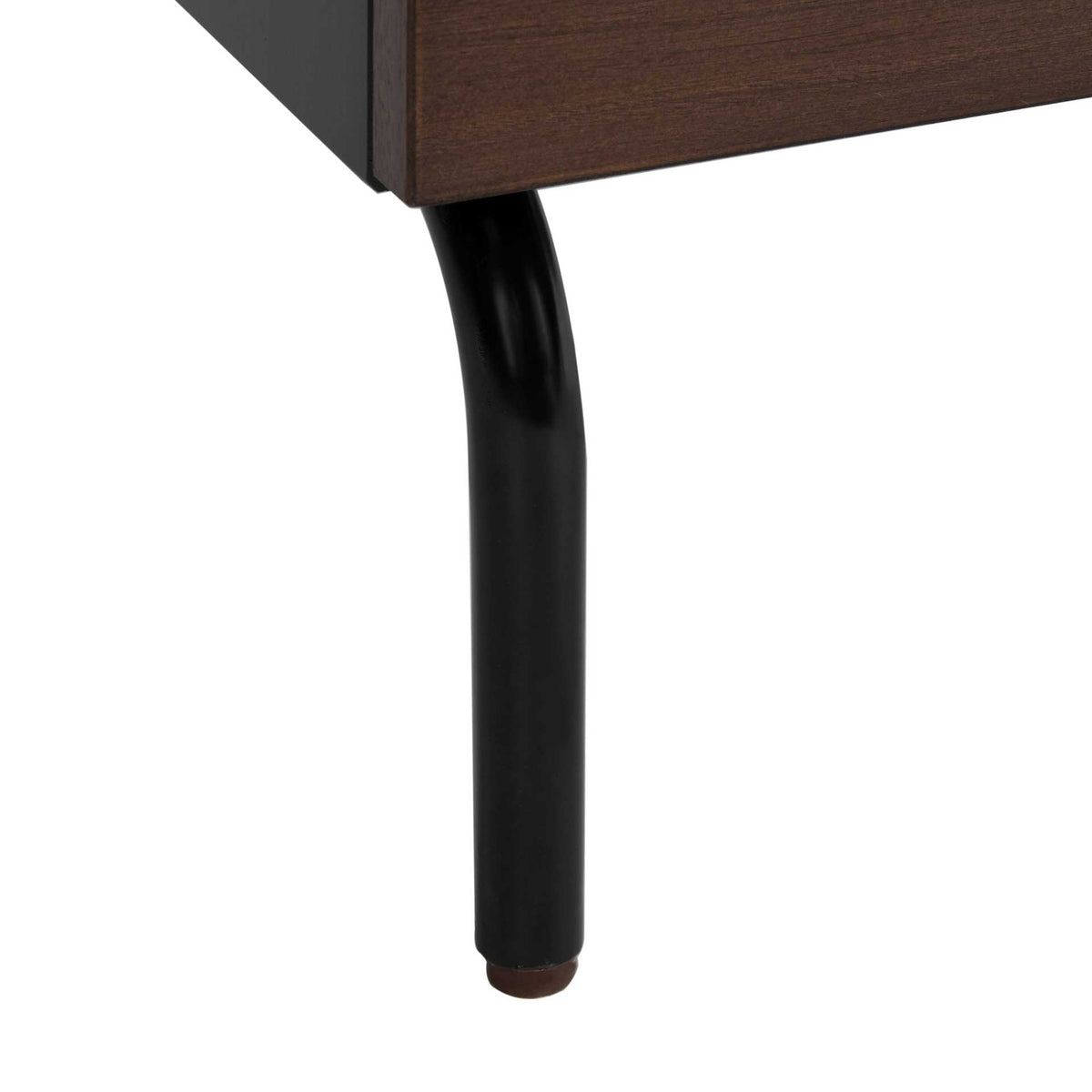 A slender black metal leg curves down from the walnut-toned drawer cabinet.