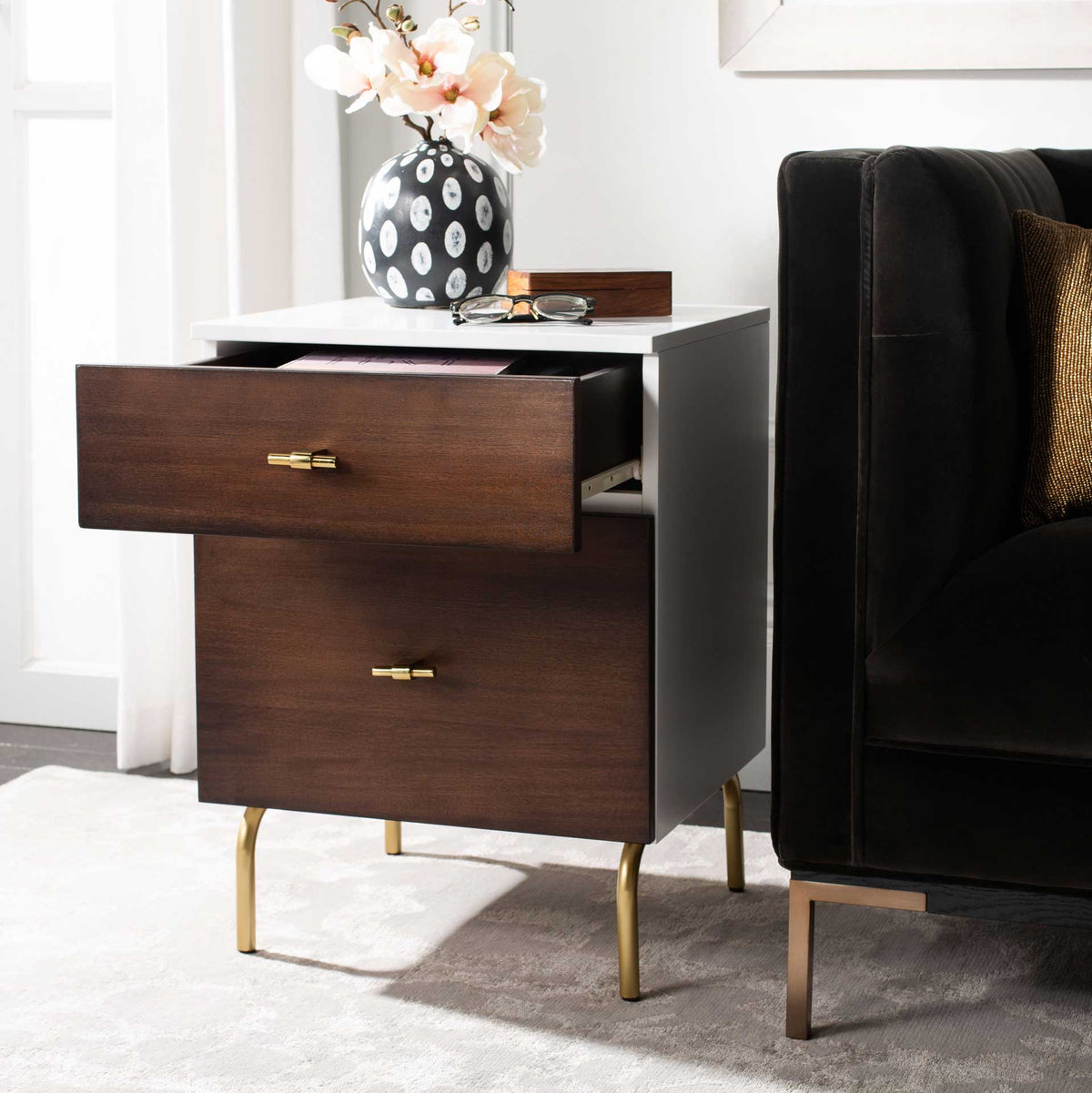The top walnut-toned drawer opens for convenient access, framed by a white top and gold-tone legs.