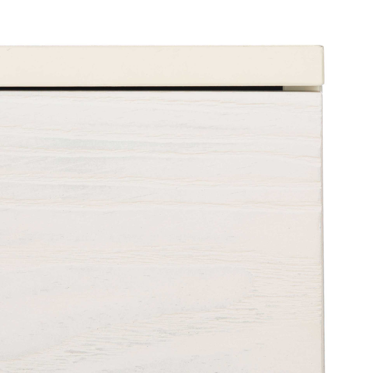 A pale wood-grain drawer front pairs with the soft cream edge of the tabletop.