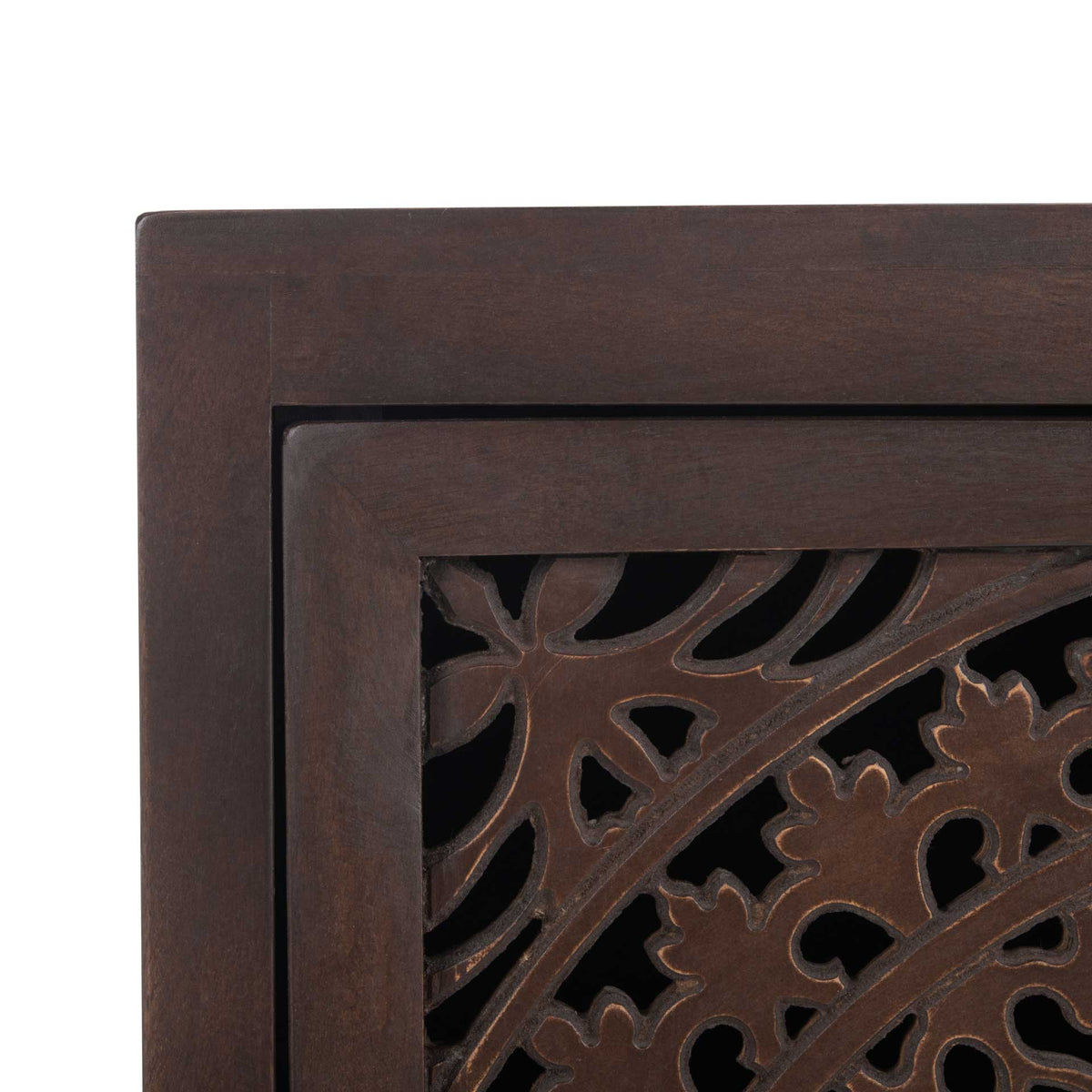 Intricate floral cutouts and circular carvings add depth to the brown cabinet door