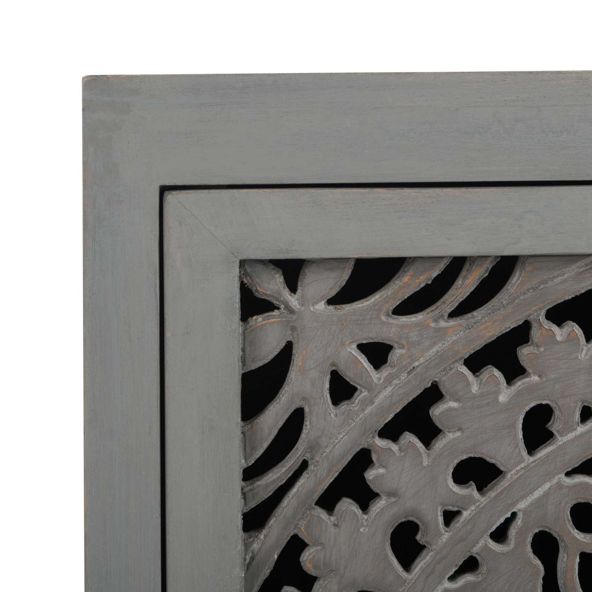 Subtle grain and floral cutouts add texture to the gray cabinet door