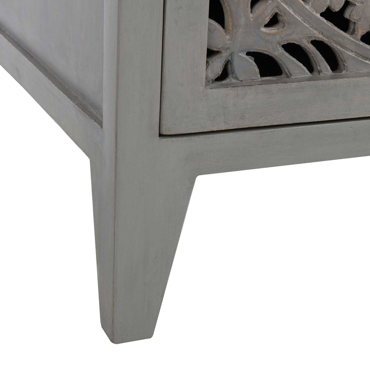 A tapered gray leg anchors the nightstand beneath its intricately carved door
