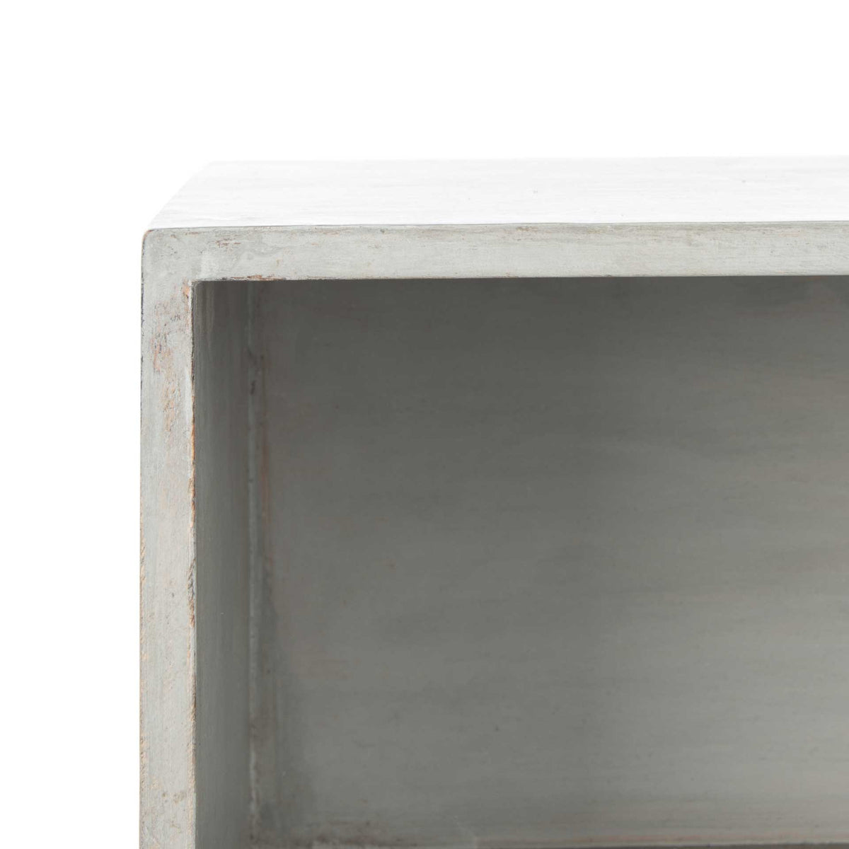The open cubby's smooth gray interior offers accessible storage above the drawer