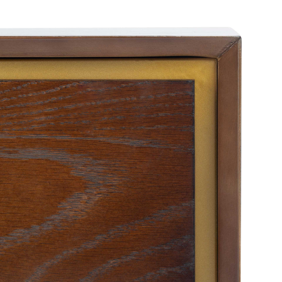 Inset brass-colored trim lends contrast to the walnut-finish drawer and its rich wood grain