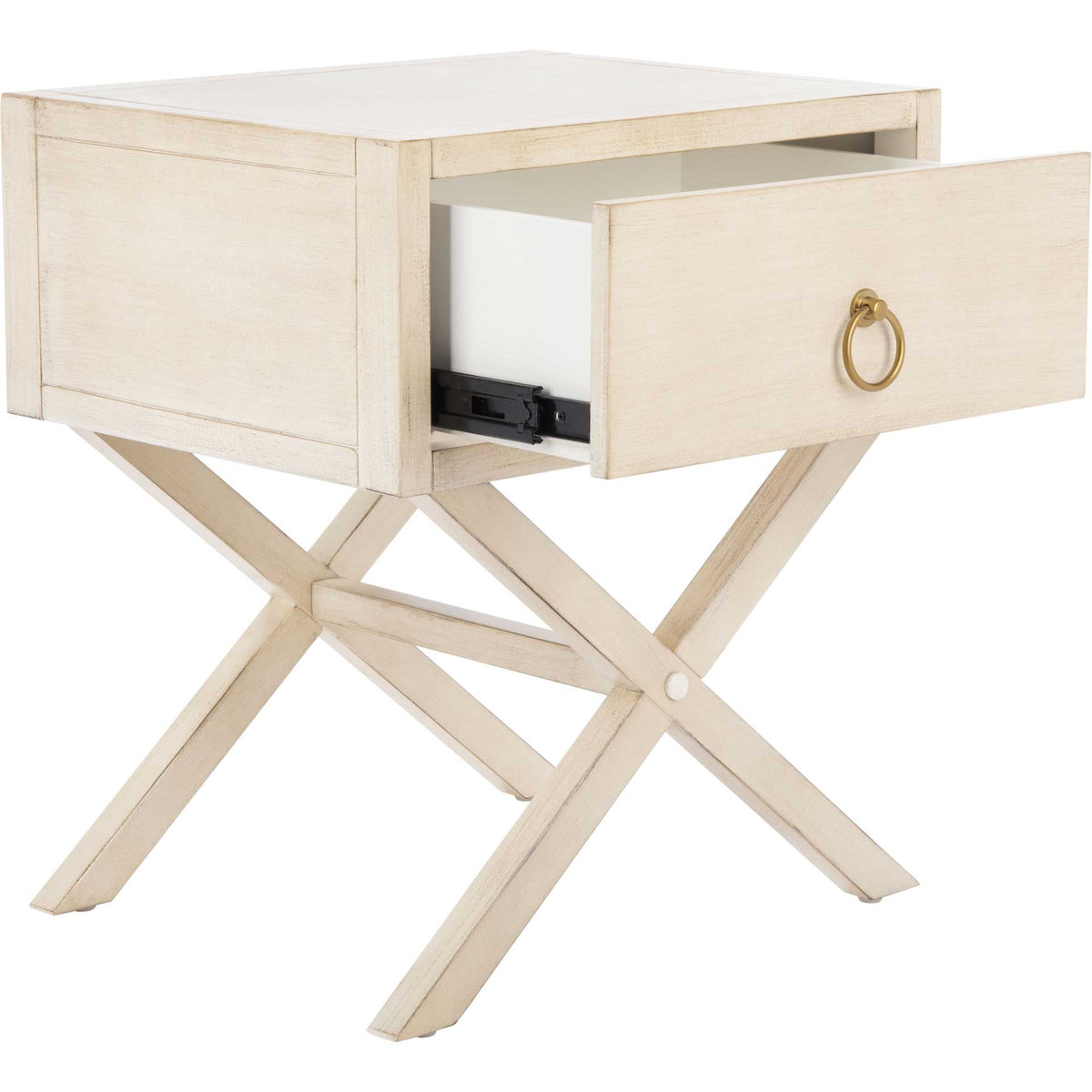 A roomy drawer opens above the crossed wood legs of this antique white nightstand.