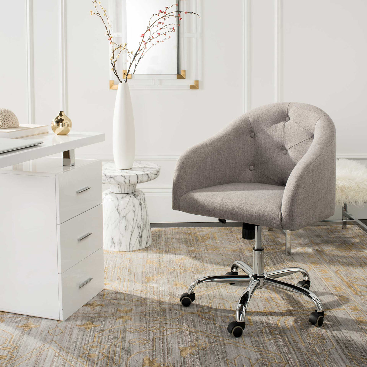 Gray linen office chair brings button-tufted comfort and rolling chrome style to a workspace