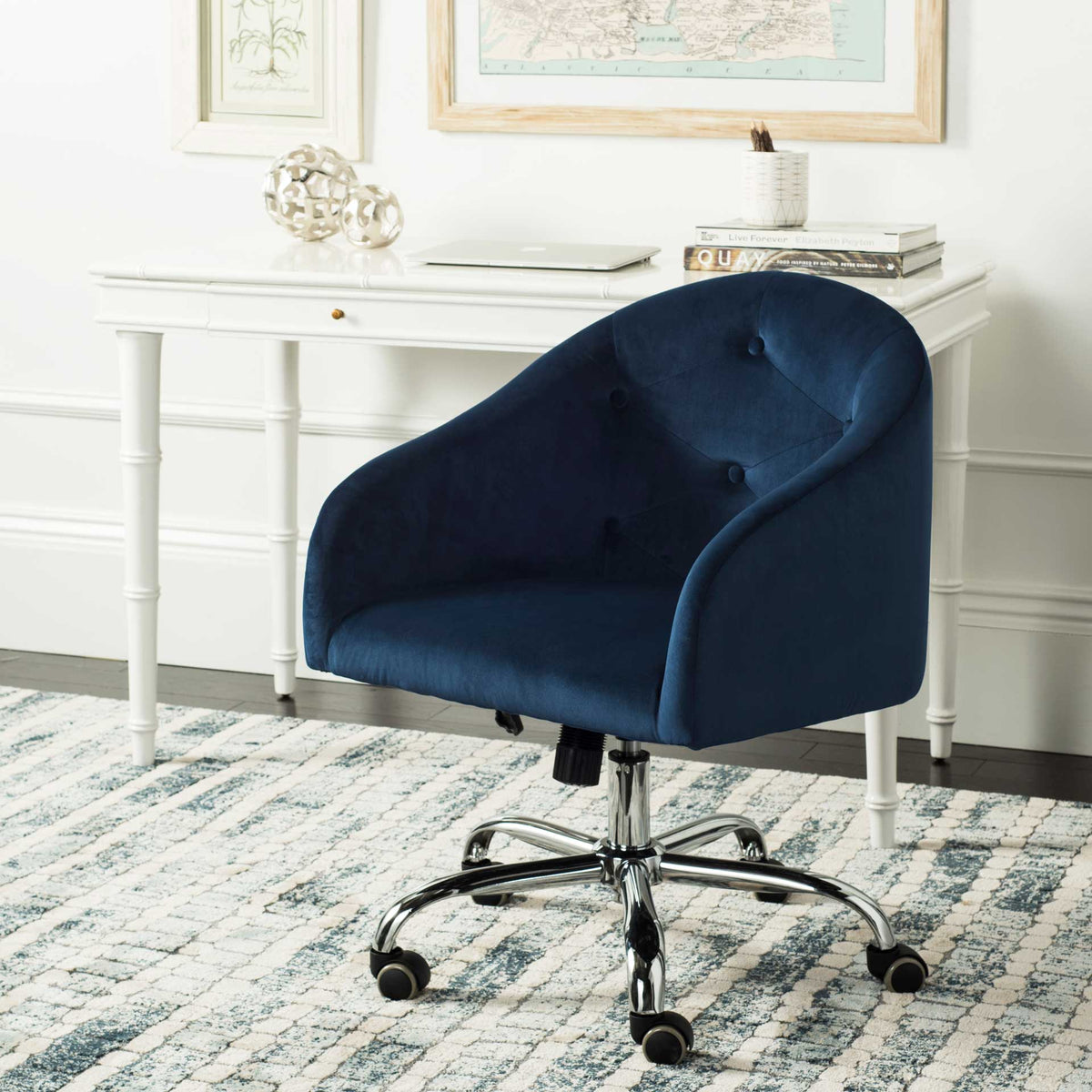 Navy velvet office chair brings tufted comfort and an easy-rolling chrome base to a workspace