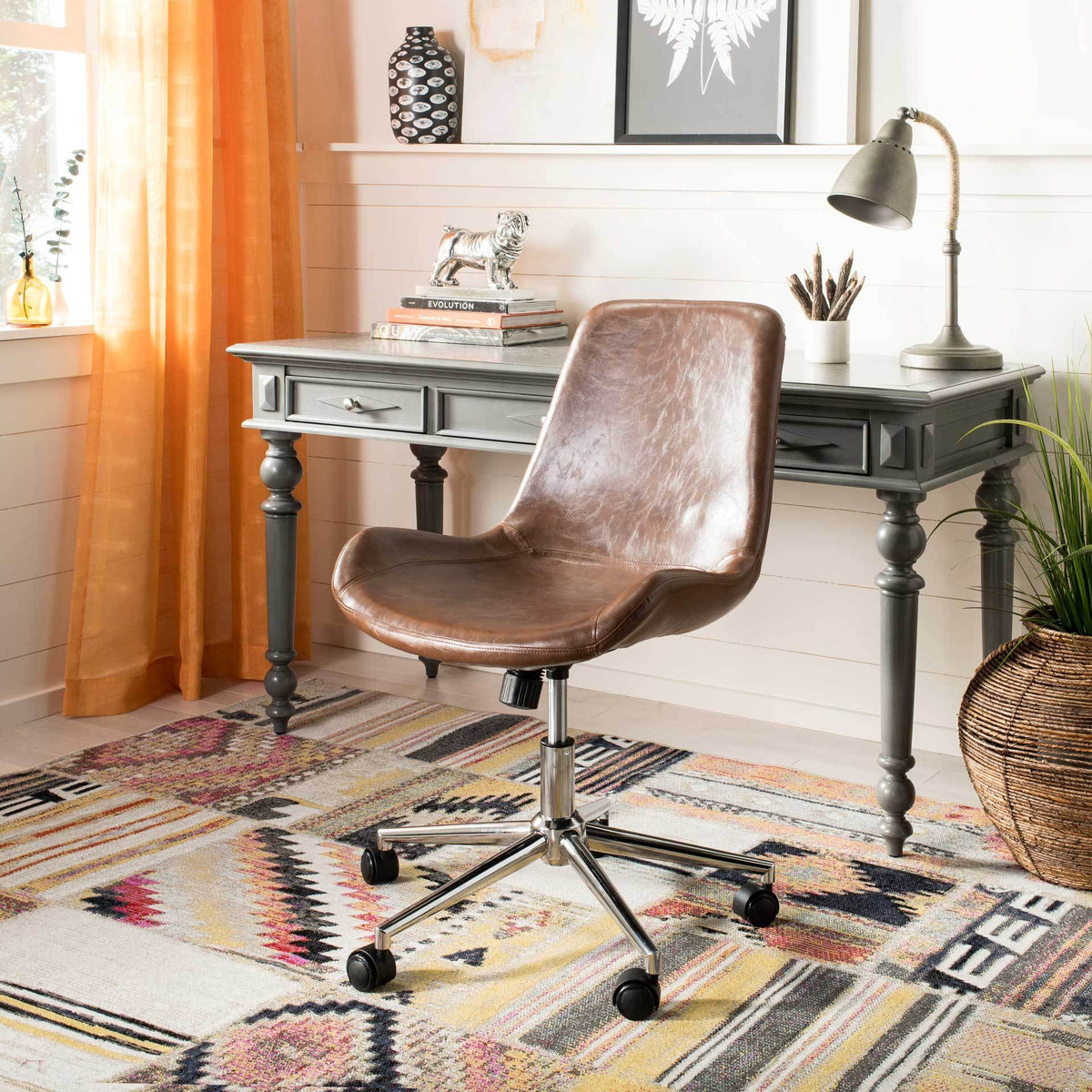 Warm brown faux leather and a polished rolling base bring vintage character to a home workspace