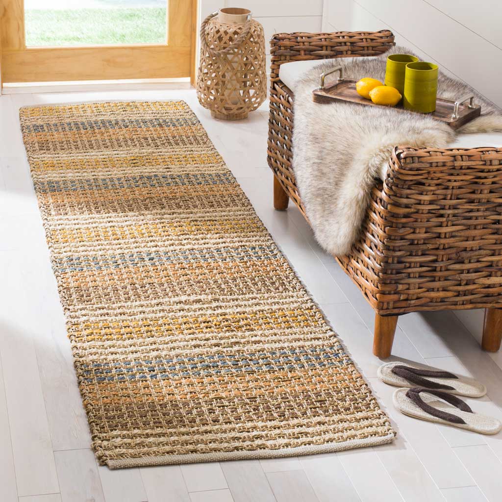 Textured jute runner brings earthy blue and ochre stripes to a welcoming entryway.