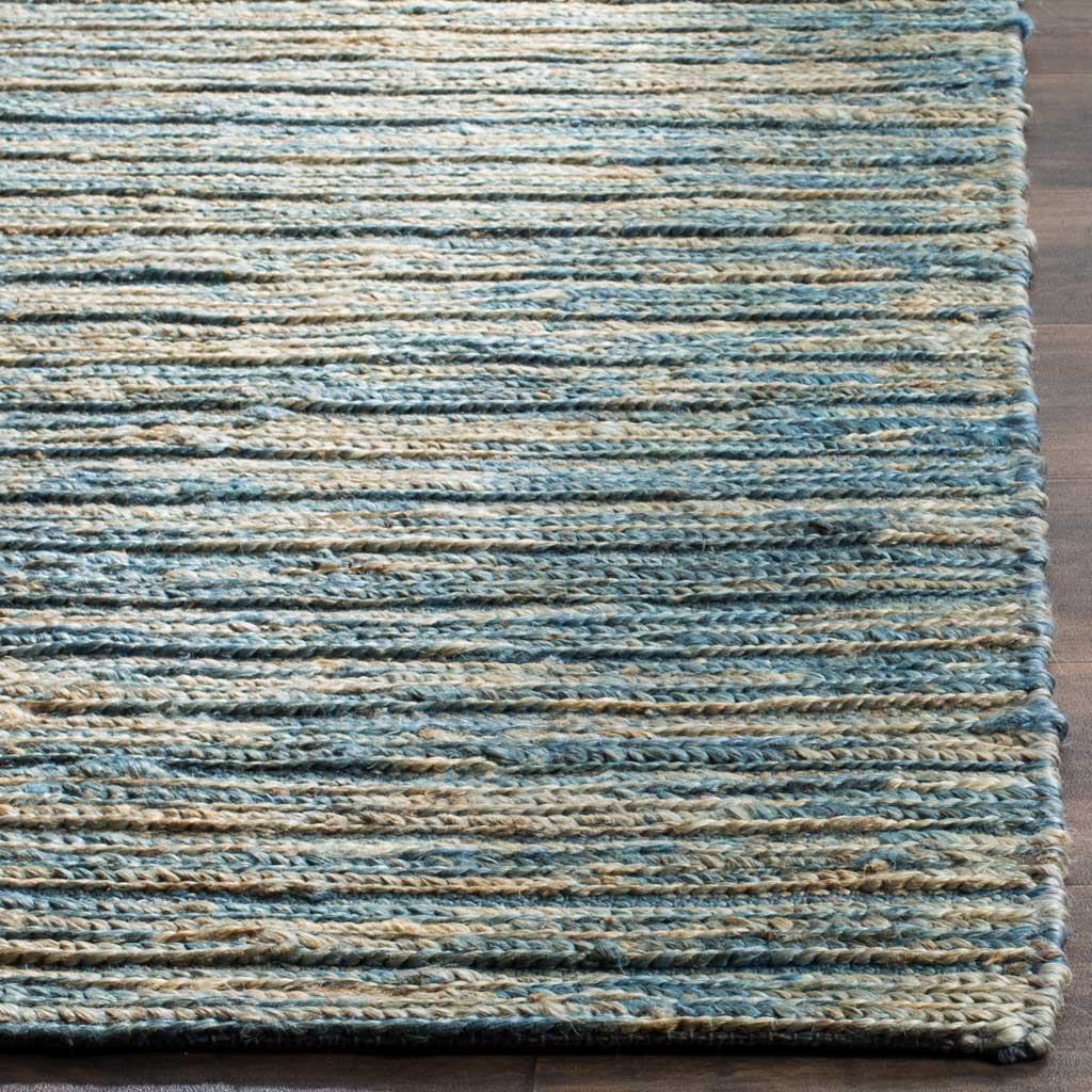 Blue and natural jute fibers meet at a neatly finished edge for artisanal texture.