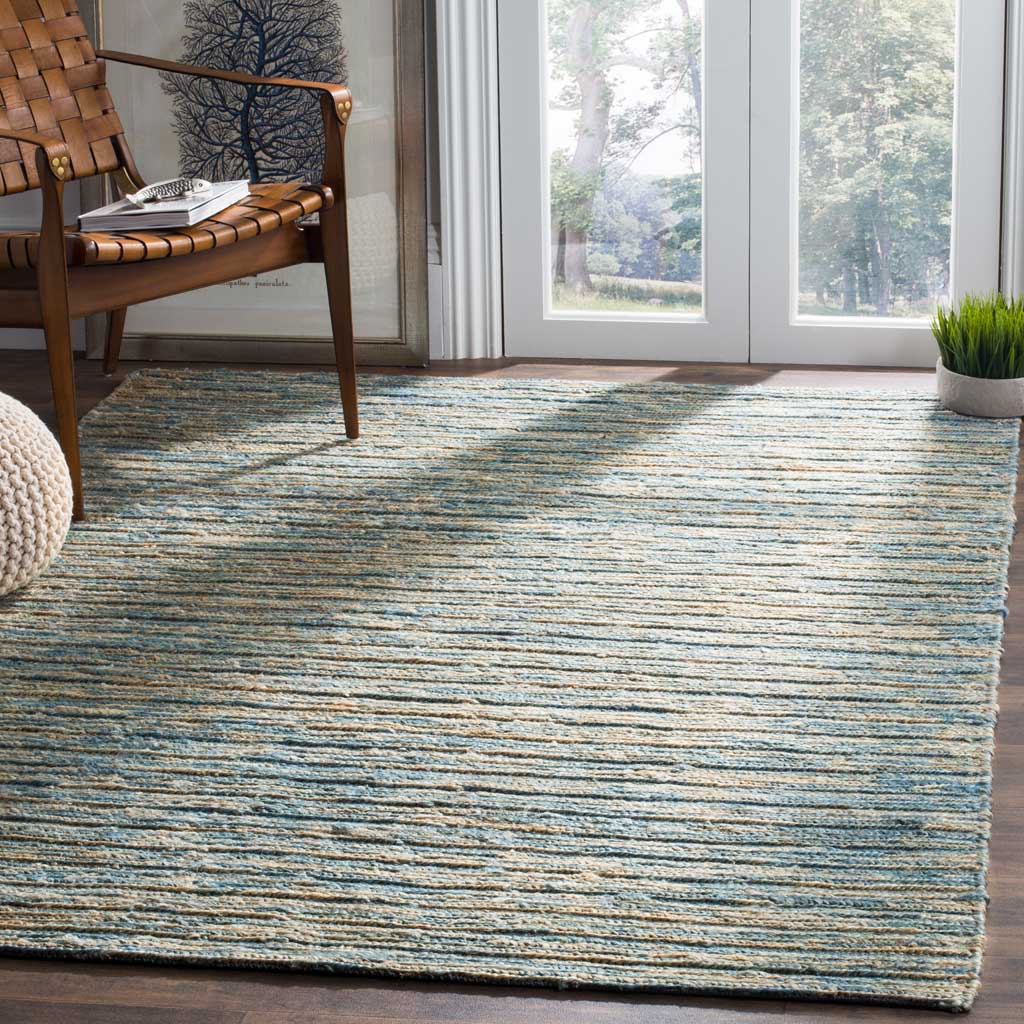 Blue and natural jute stripes add easygoing texture and warmth to a bright living space.