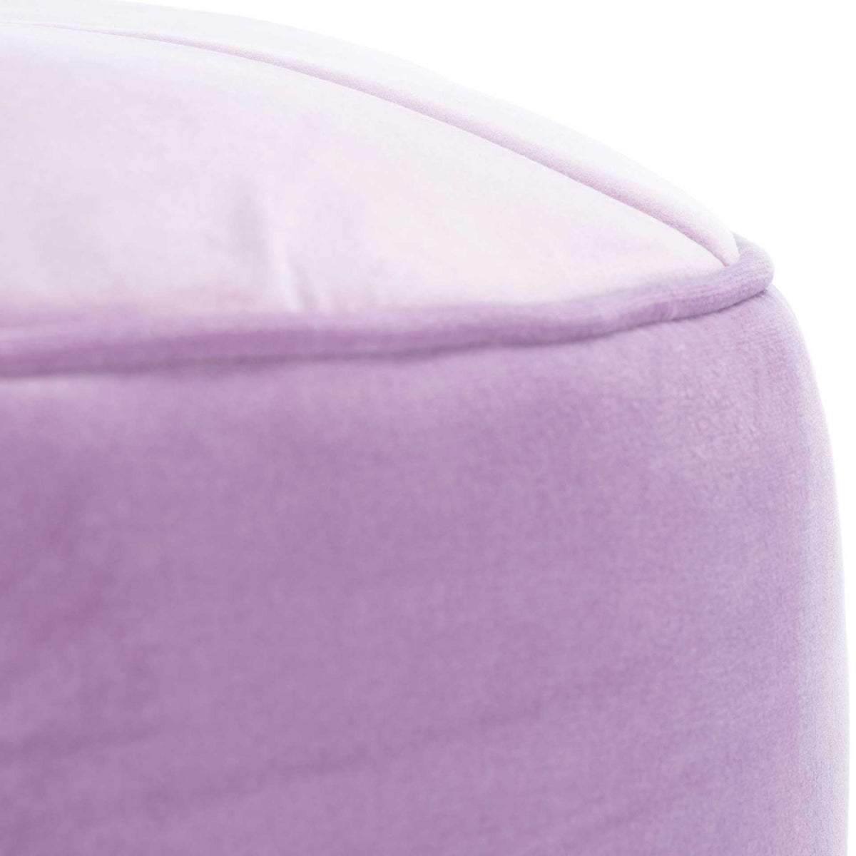 Plush lilac velvet and a neatly piped edge add texture to the softly cushioned top.
