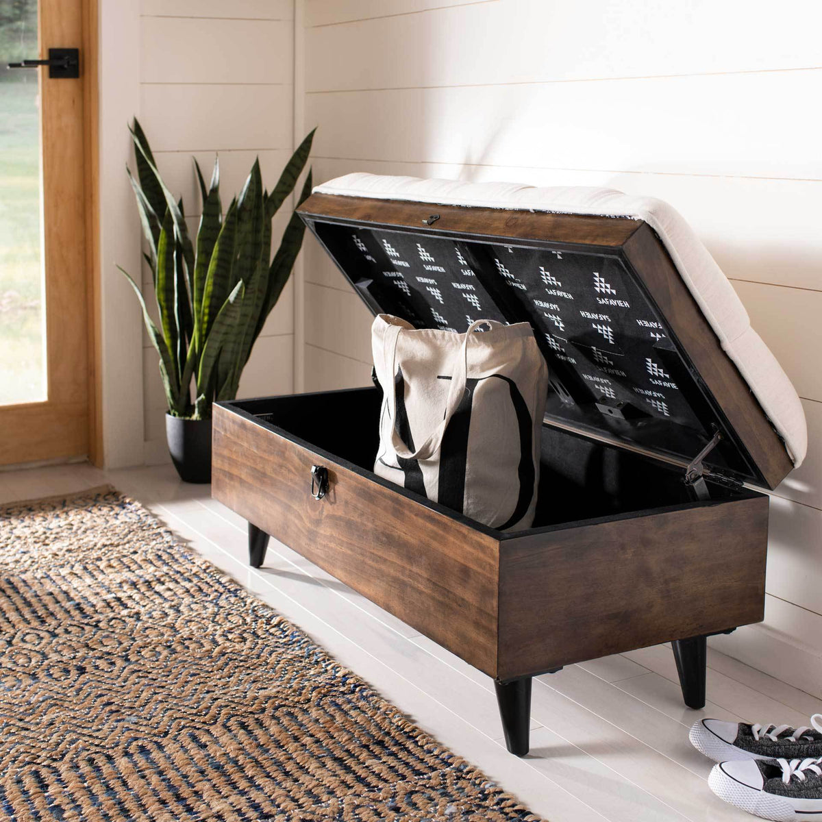 The beige upholstered lid opens to roomy storage for bags and other daily essentials.