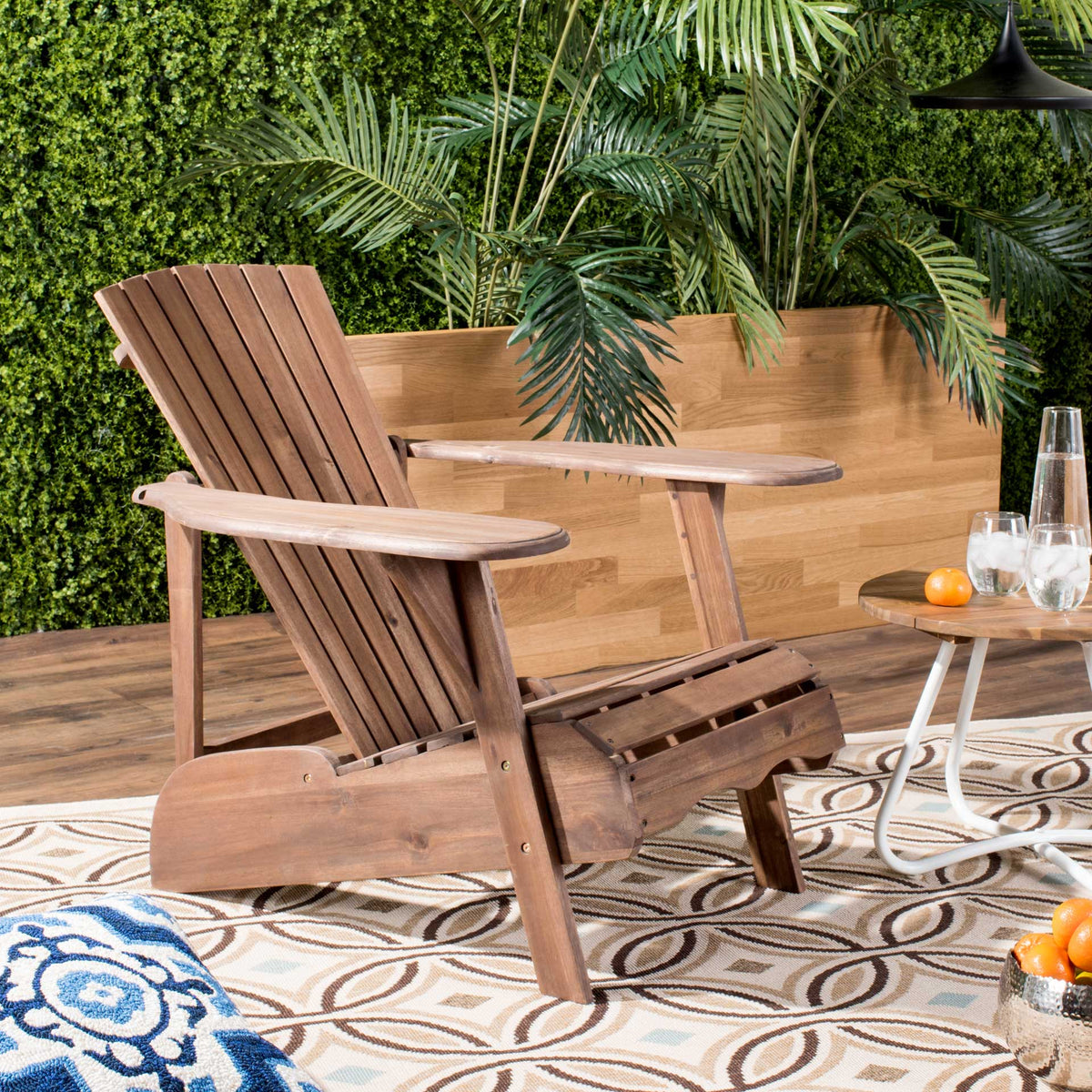 A warm brown acacia finish and roomy arms make this chair a laid-back patio favorite