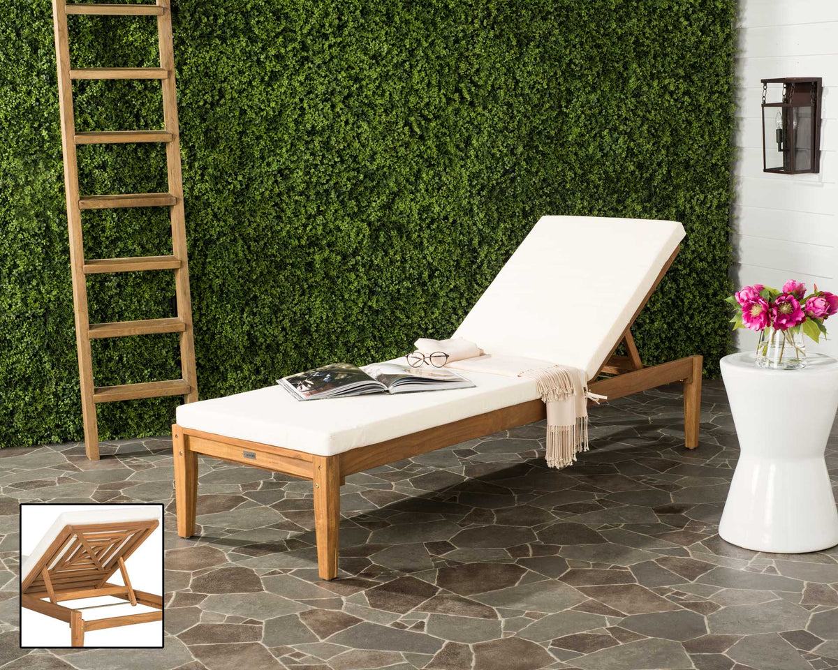 Natural wood and a beige cushion make this outdoor lounger a welcoming place to unwind.
