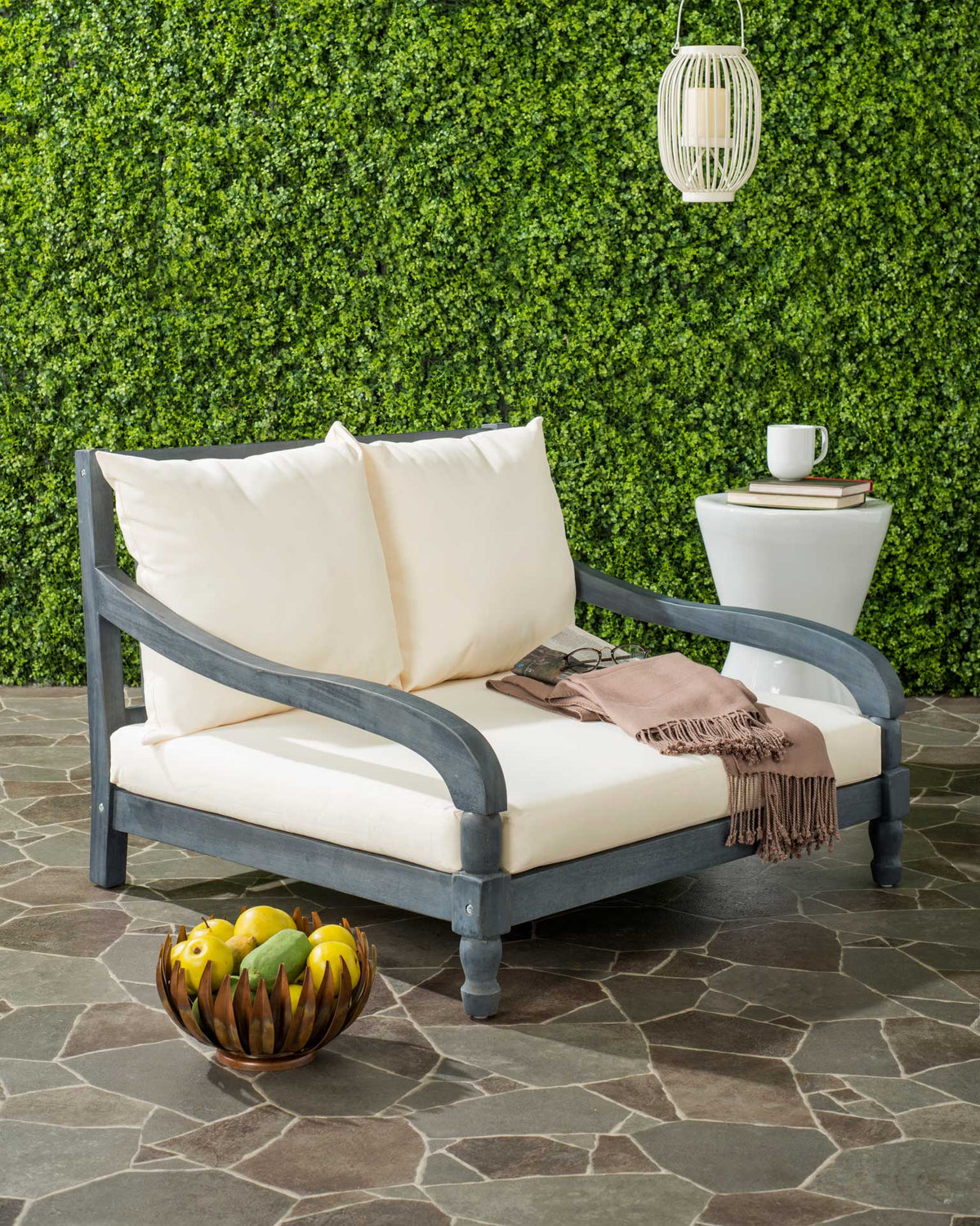 Ash gray acacia frame and deep beige cushions invite relaxed outdoor lounging