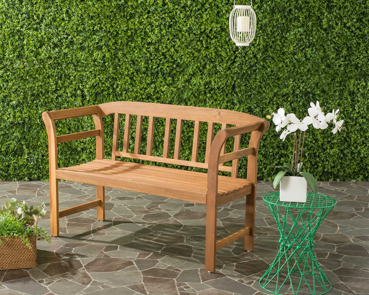 A natural acacia bench pairs a slatted seat with curved arms for easygoing patio style.