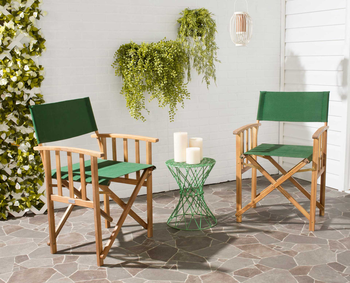 Matching green and natural wood chairs offer relaxed seating on a plant-filled patio
