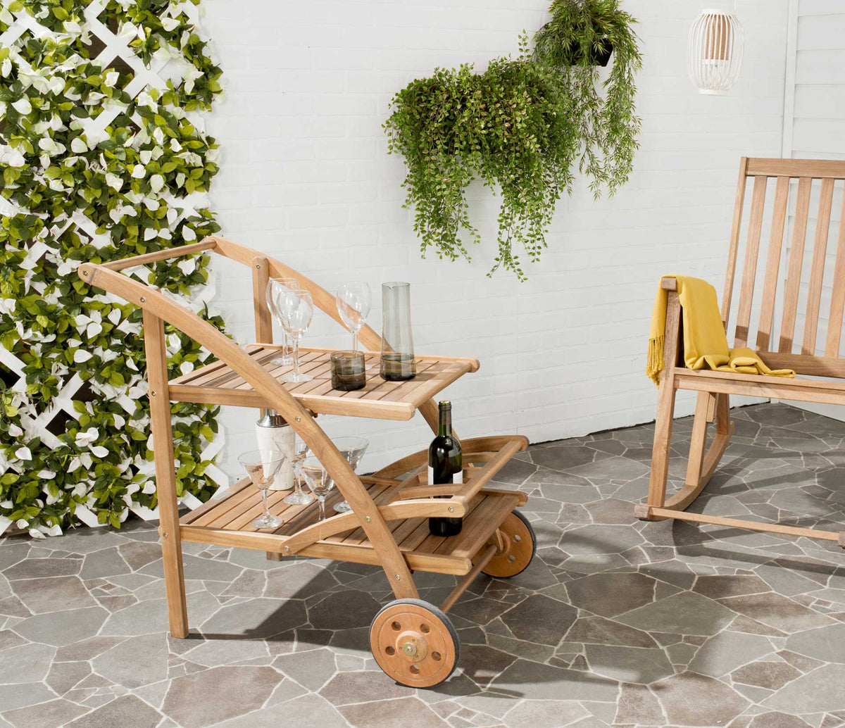 Natural wood slatted shelves hold drinks and glassware, ready for easy entertaining on the patio.