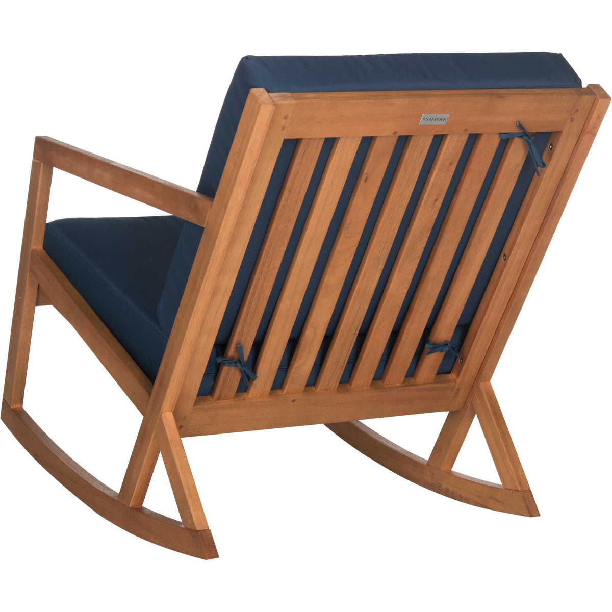 Open wood slats and navy cushion ties add airy structure to the chair's angled back.