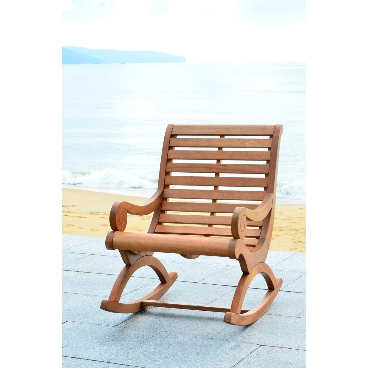 Honey-toned wood, graceful scroll arms and an airy slatted back invite relaxation by the water