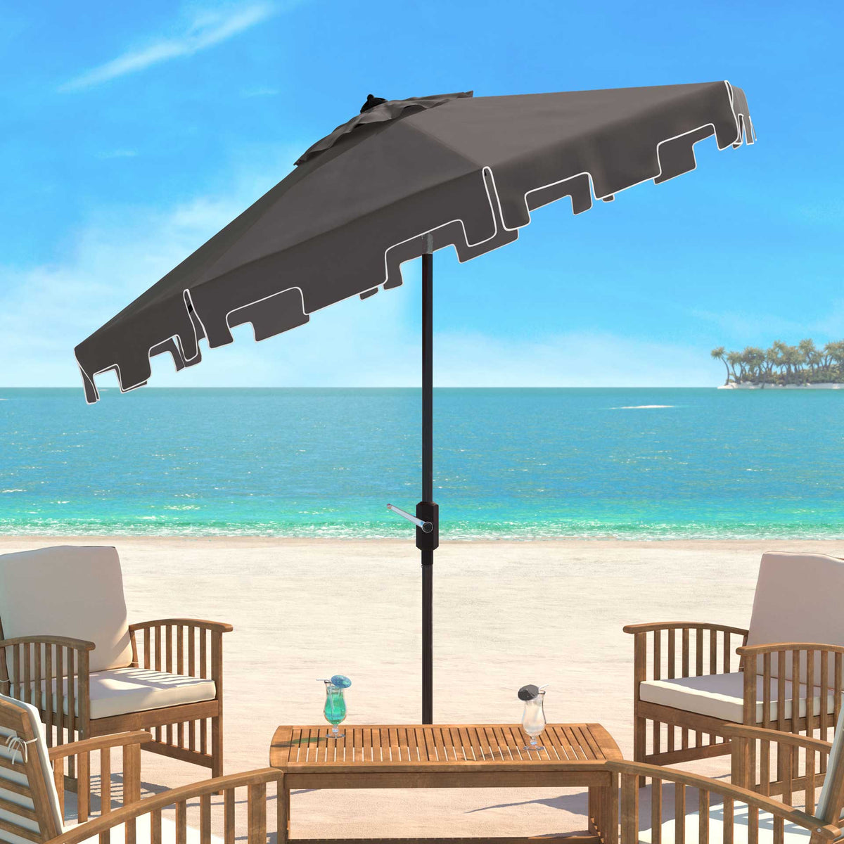 Gray patio umbrella tilts over seating, its white-edged valance framing the canopy