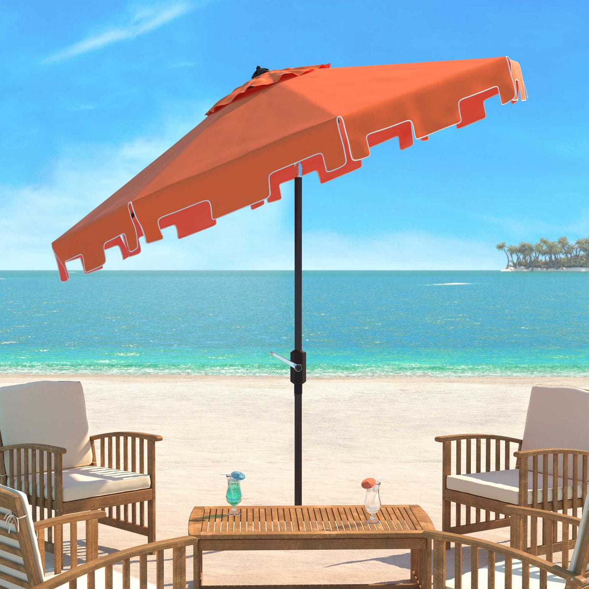 Orange umbrella tilts over patio seating, with white trim outlining its valance
