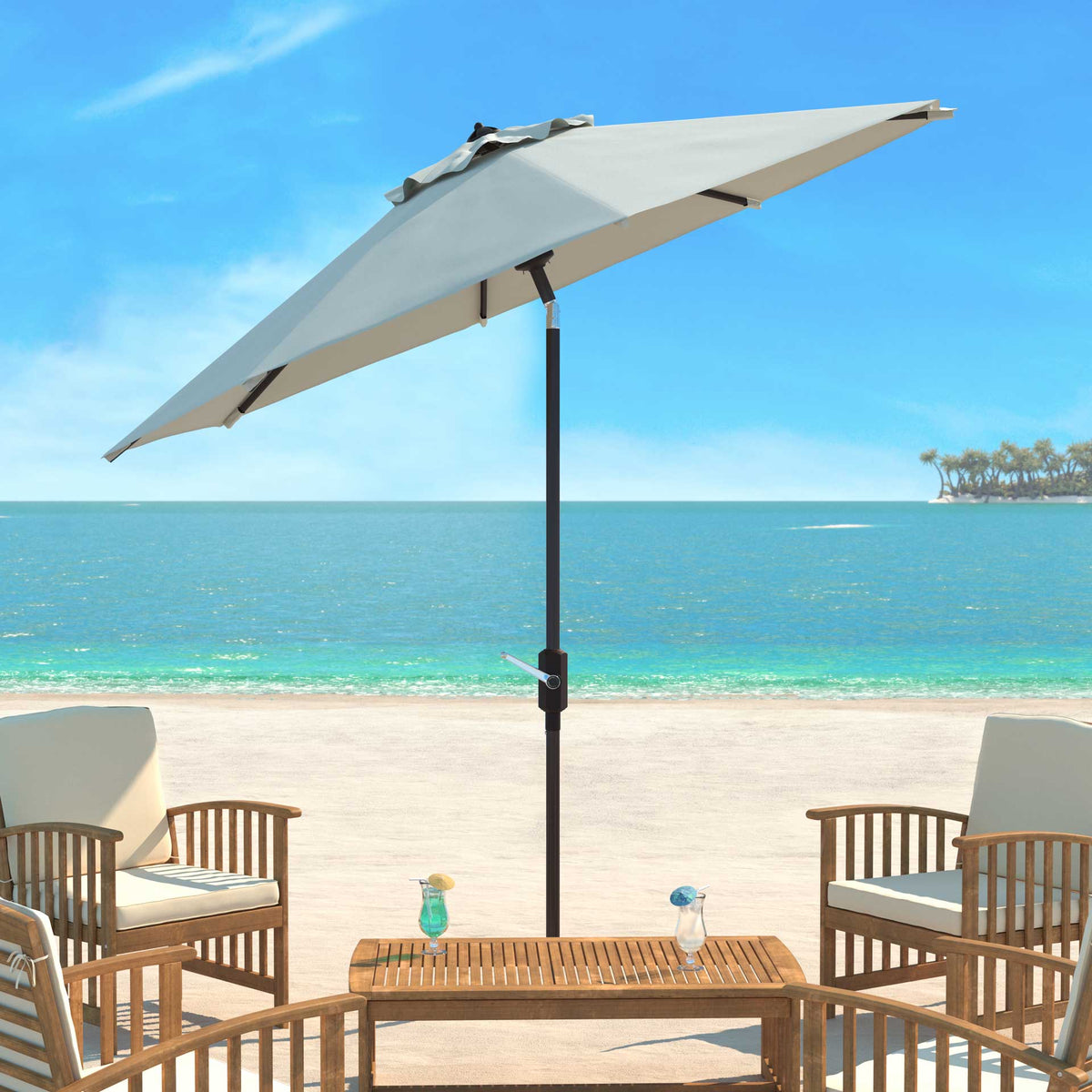 An ivory tilting canopy shades an outdoor dining table and cushioned chairs