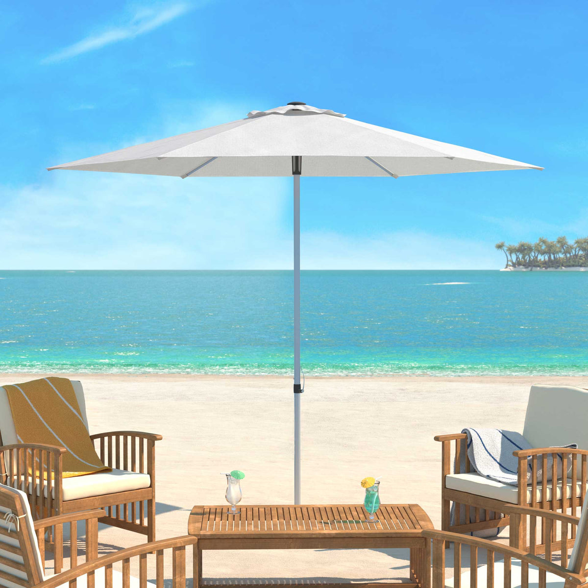 An ivory canopy shades outdoor seating beside the water.