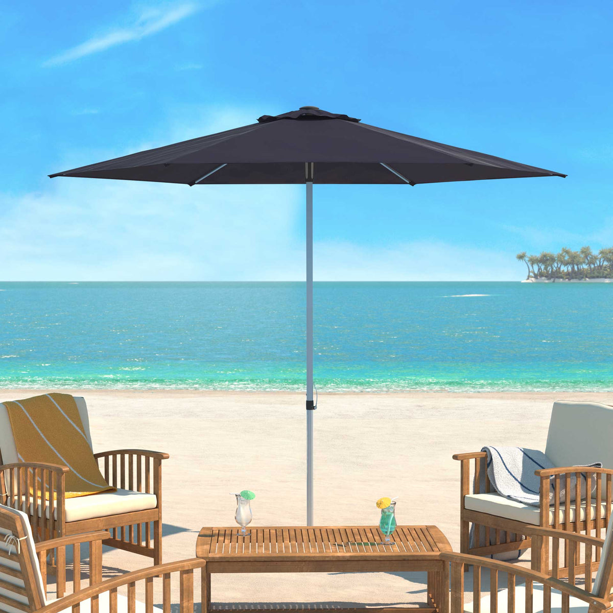 Navy fabric brings inviting shade to an open-air seating area by the sea.